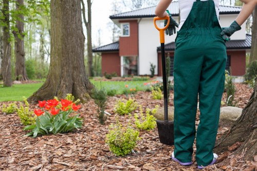 Gardener addressing issues during a final site visit
